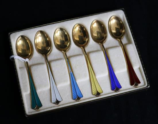 A set of 6 Norwegian silver gilt and polychrome enamel spoons by David Andersen.